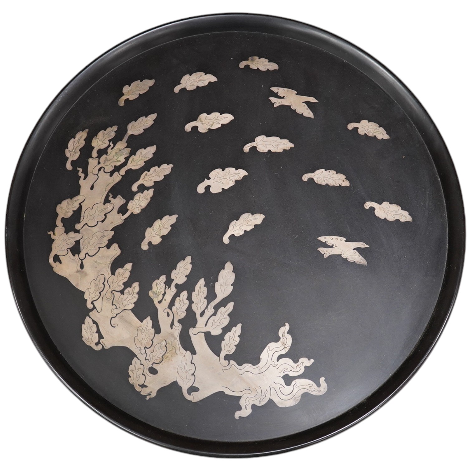 A Swedish Perstorp circular silver inlay isolit tray, dated 1957, decorated with a windblown tree and bird, 41.5cm diameter. Condition - minor scratches to surface